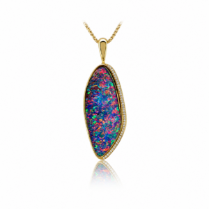 This exceptional solid Australian gem-grade 31.58ct boulder opal pendant showcases features red, pink and purple fire, beautifully accented by diamonds