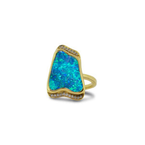Make a statement with this natural Australian boulder opal ring, featuring brilliant blue and green play-of-colour in 18K yellow gold setting