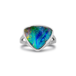 Discover the vibrant beauty of Australia with this handcrafted Queensland boulder opal ring, featuring dazzling blue, green and orange flashes in a contemporary 18k white gold setting accented with diamonds.