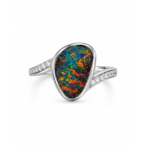 Discover the beauty of this handcrafted Australian boulder opal ring, featuring a freeform gem-grade boulder opal with vibrant red and orange play of colour in an elegant 18k white gold setting. Designed in a comfortable everyday size, this one-of-a-kind opal ring combines natural Australian beauty with timeless wearability. Perfect for collectors seeking authentic Australian boulder opal jewellery with exceptional colour and character.