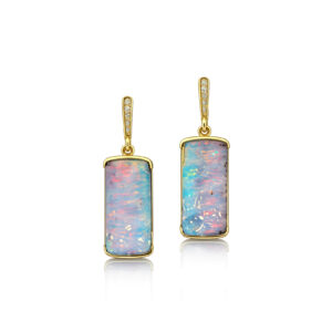 This handcrafted Australian boulder opal earrings features a striking rectangular gem with a soft play of blue and pink colour, reminiscent of an impressionist landscape. Set in elegant 14k yellow gold, this one-of-a-kind boulder opal ring showcases the natural artistry and individuality that make Australian opals so highly prized. A timeless piece for collectors of fine Australian opal jewellery.