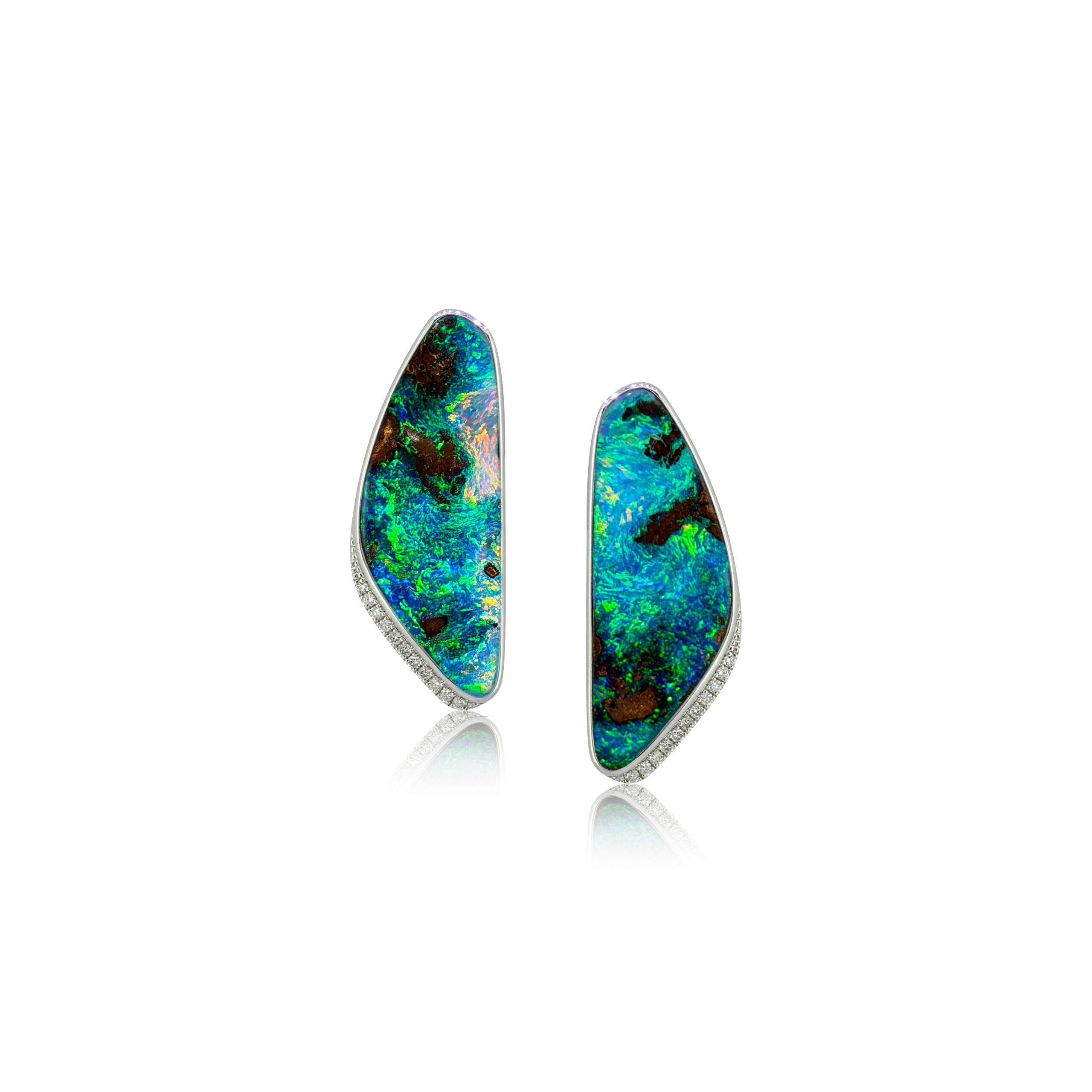 Discover these handcrafted Australian boulder opal earrings, showcasing an incredible sea scape pattern with mesmerising movement of brilliant green and blue colour. Expertly crafted in 18k white gold, these one-of-a-kind earrings are a stunning example of fine Australian opal jewellery